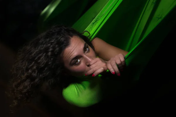 Closeup portrait of girl posing in a green silk hammock - aerial — Stock Photo, Image