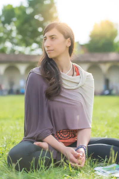 Student girl sitting in the school lawn — Stock Photo, Image