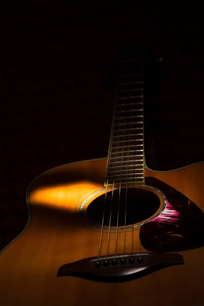 Acoustic guitar on black background — Stock Photo, Image