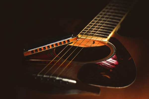 Detail of a Acoustic guitar with country blues harmonica — Stock Photo, Image