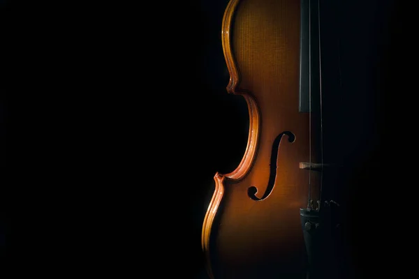 Violin on a black background with spot light — Stock Photo, Image