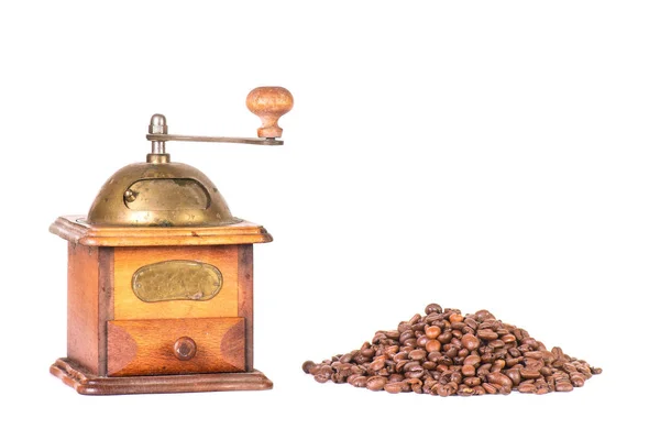 Coffee grinder with mountain of coffee beans Stock Image