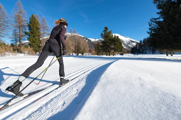 Girl practices Nordic skiing with alternating step — 스톡 사진