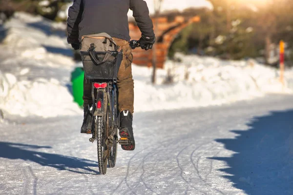 Ride your bicycle on a snowy road in winter — Stock Photo, Image