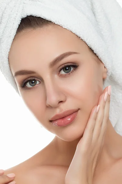 Portrait of young beautiful woman with towel on her hair touchin — Stock Photo, Image