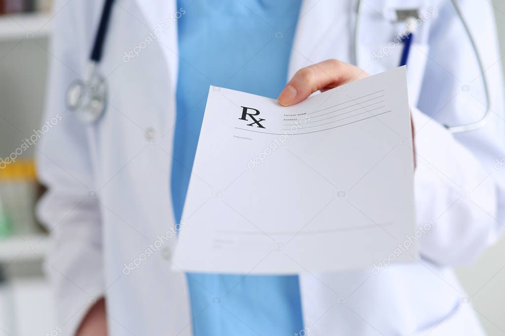 Medicine doctor hand giving prescription