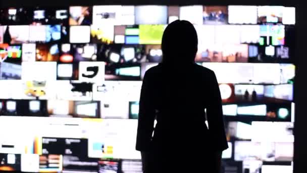 Silhouette of a woman on the background of a social network . — Stok video