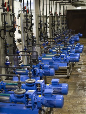 The engine room at the treatment facilities .Equipment inside the industrial premises .