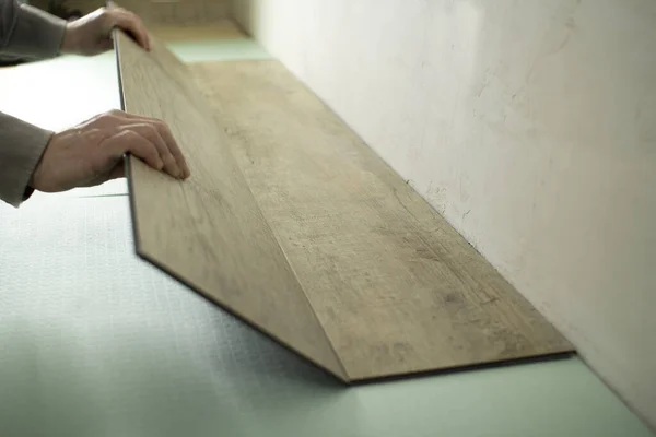 Vinyl laminate. Laying of the floor covering. — Stock Photo, Image