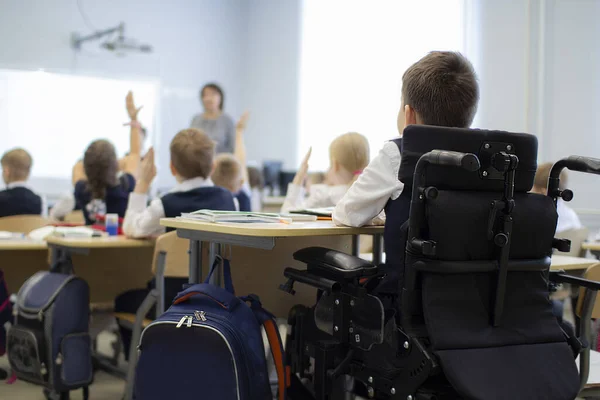 A disabled student in a wheelchair in primary school.