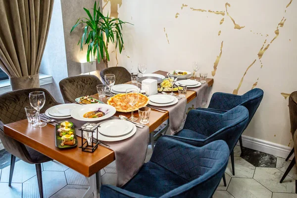 focus on glasses. Banquet table in the restaurant, the preparation before the banquet. restaurant with cozy interior.