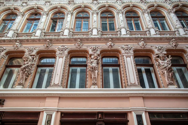 Facade of Passage, a historical building with baroque statues, sculptures and ornaments in the old town of Odessa, Ukraine June 2019 Central Europe.