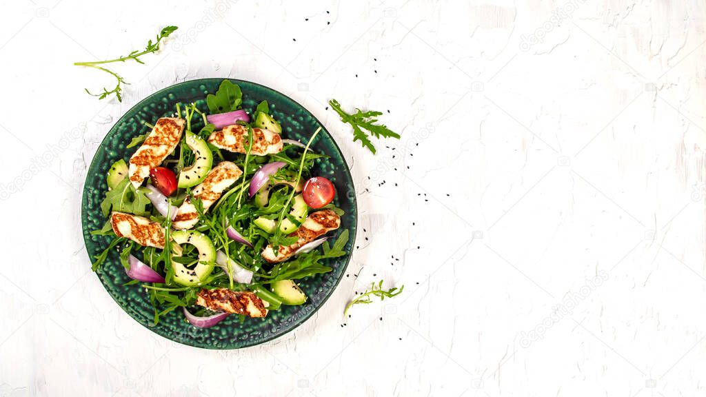 Fresh salad with fruits and greens on white wooden background top view with space for text. Healthy food.