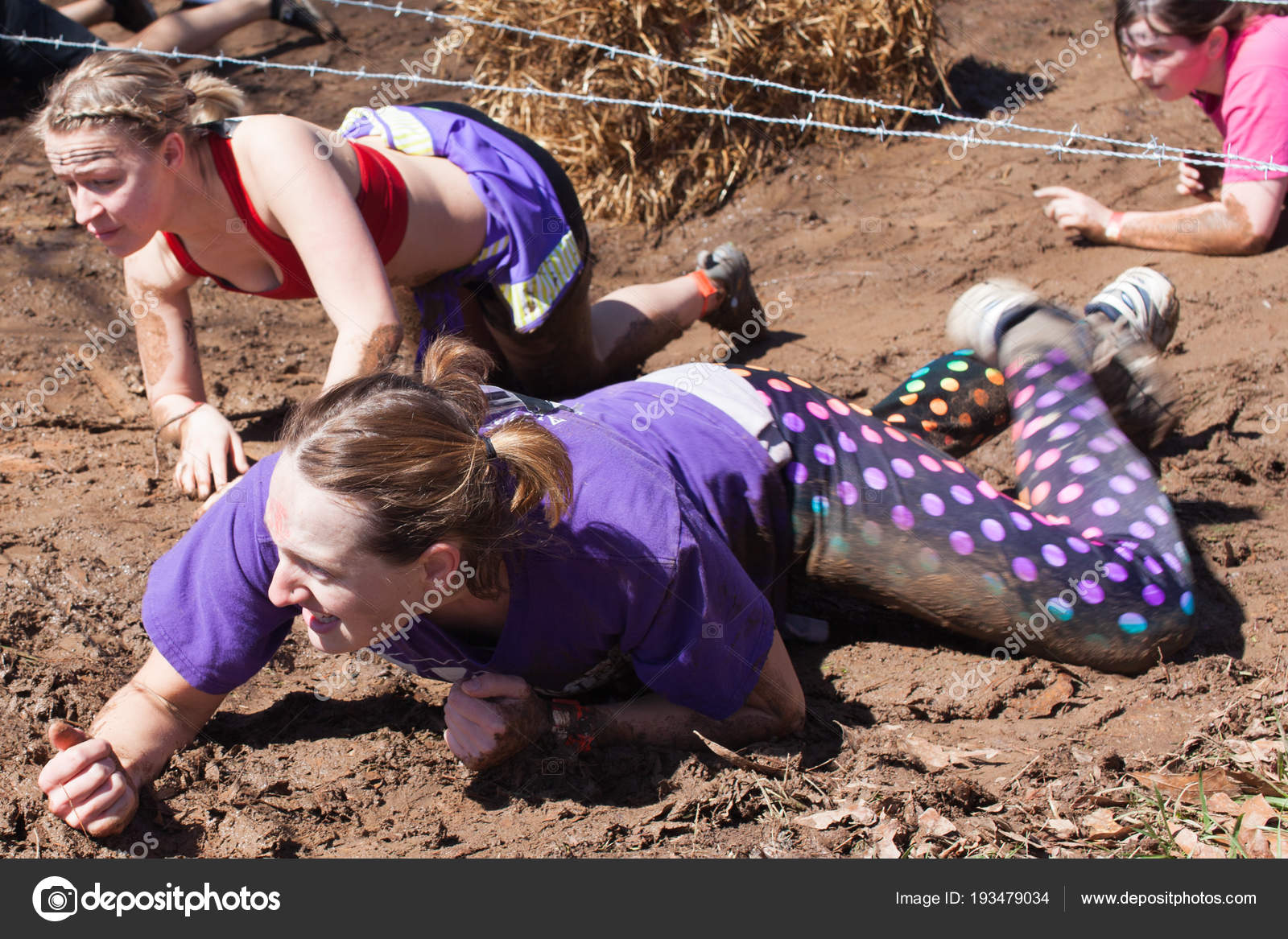 Women Crawling Thru Mud Compete Spartan Race Stock Editorial Photo