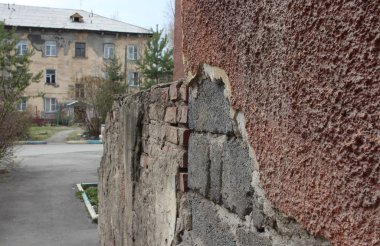 old plaster fell off the facade of the building the destruction of the house of historical development