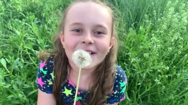 Blond Girl Blowing Dandelion Green Garden — Stock Video