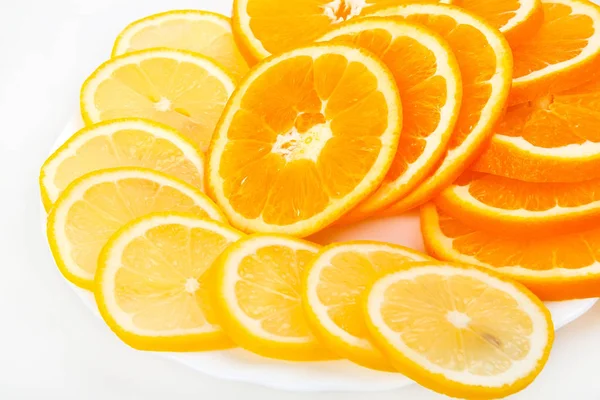 Composition of a pile of juicy orange and lemon slices — Stock Photo, Image