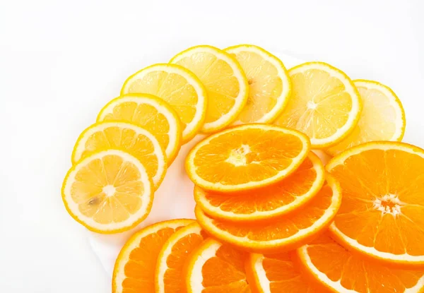 Composition of a pile of juicy orange and lemon slices — Stock Photo, Image