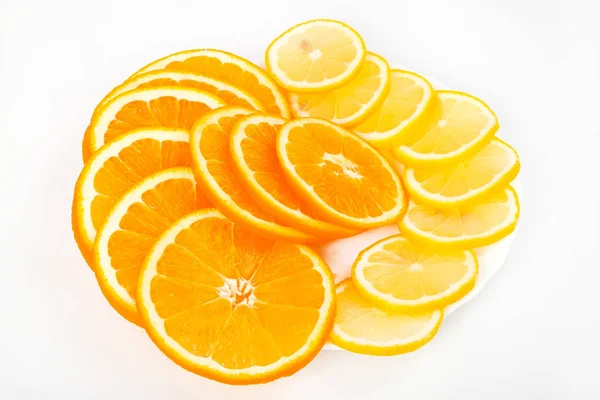 Composition of a pile of juicy orange and lemon slices — Stock Photo, Image