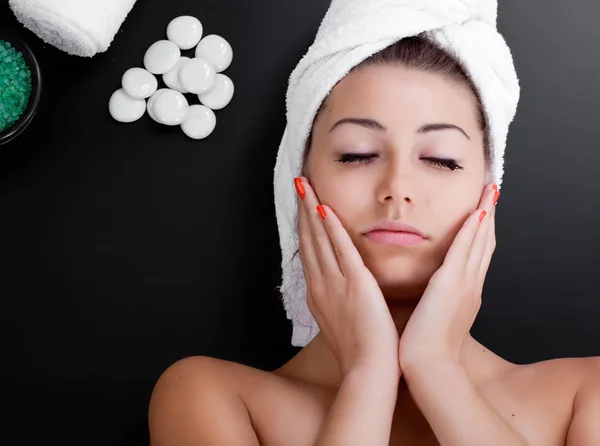 Mask, massage of face for woman in spa salon on black background — Stock Photo, Image