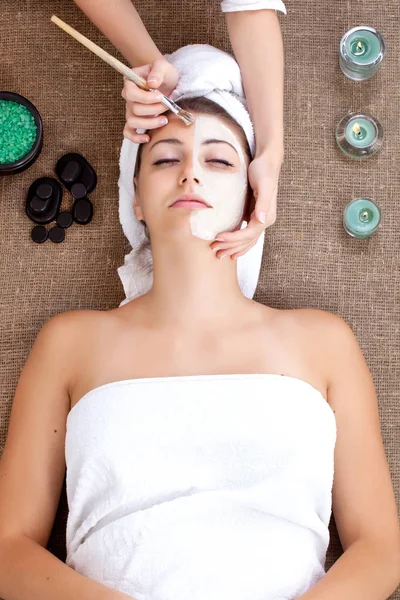 Mask, massage of face for woman in spa salon — Stock Photo, Image