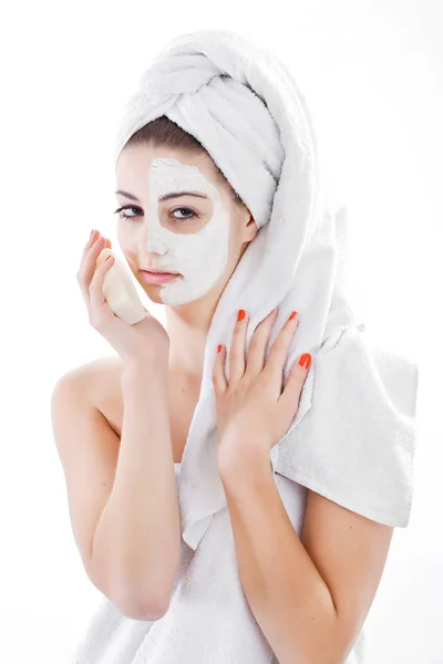 Woman in headband with lifting cream applied on a half of her fa — Stock Photo, Image