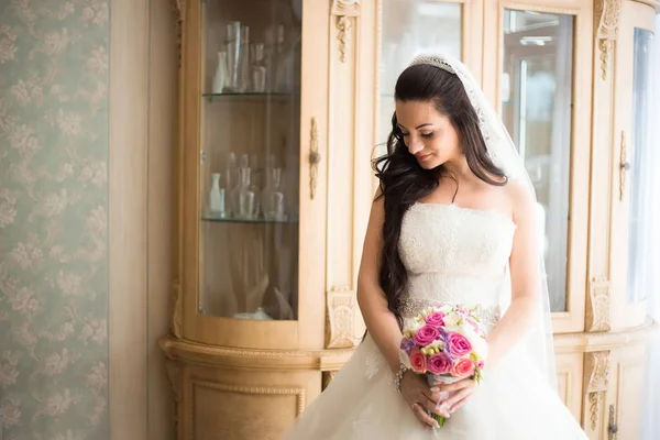 Gorgeous bride in wedding dress in luxury interior with diamond — Stock Photo, Image