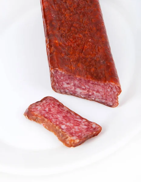 Slice italian salami sausage on white background — Stock Photo, Image