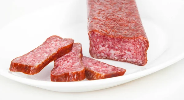 Slices italian salami sausage on white background — Stock Photo, Image