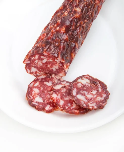 Slices italian salami sausage on white background — Stock Photo, Image