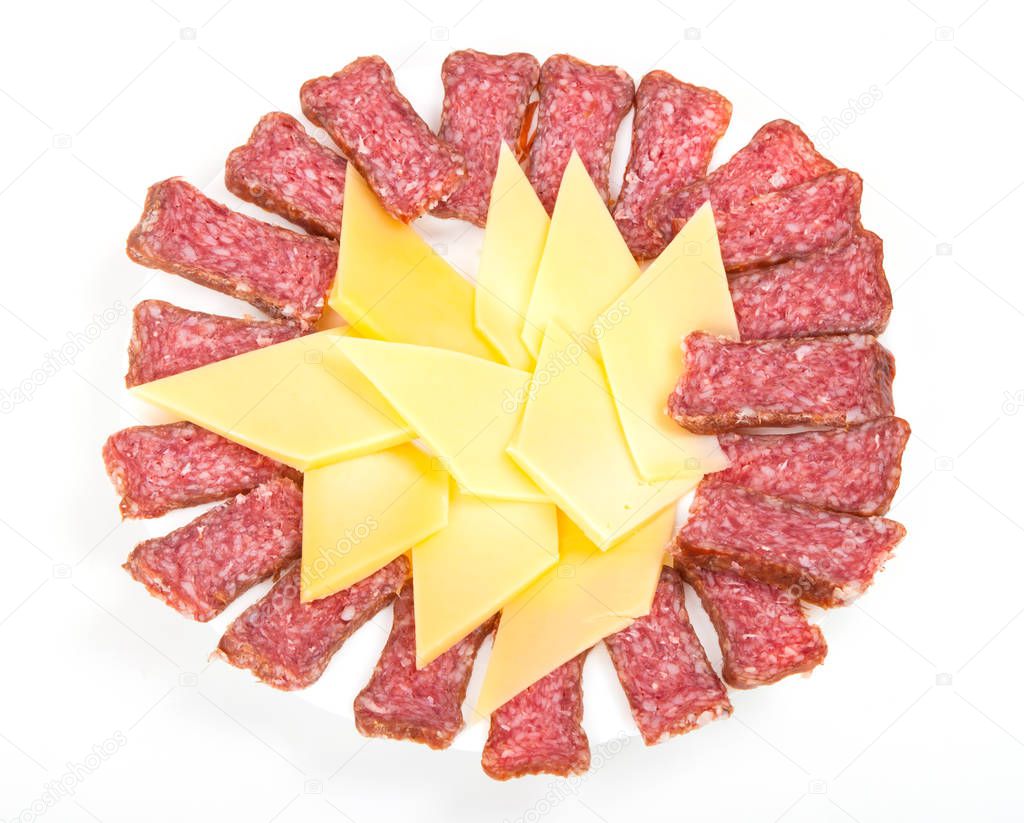 a pile of salchichon, red salami, smoked sausage and cheese on a