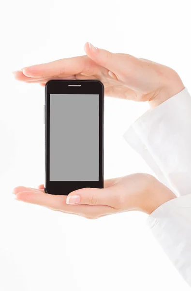La mano femminile tiene un moderno telefono touch screen. Lo schermo è cu — Foto Stock