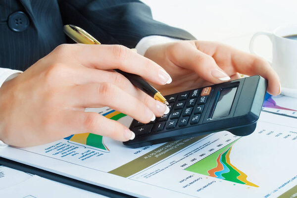 Accounting. Business woman hands in office