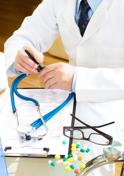 doctor with prescription patient data history sitting at workplace