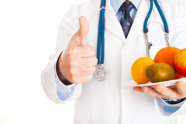 Γιατρός Δείχνει Τον Αντίχειρα Επάνω Και Πλατώ Φρούτα — Φωτογραφία Αρχείου