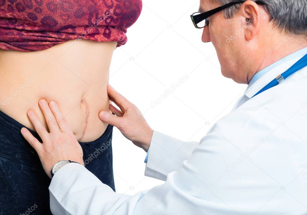 Doctor checking belly stomach after birth operation 