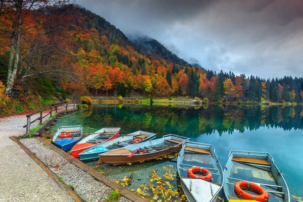 Wonderful autumn landscape and colorful boats,Lake Fusine,Italy,Europe — Stock Photo, Image