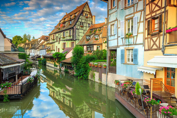 Amazing medieval half-timbered facades reflecting in water, Colmar, France