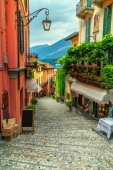 Картина, постер, плакат, фотообои "stunning scenic street with colorful houses and flowers in bellagio", артикул 189296728