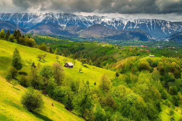 Wonderful spring landscape with snowy mountains near Brasov, Transylvania, Romania — Stock Photo, Image