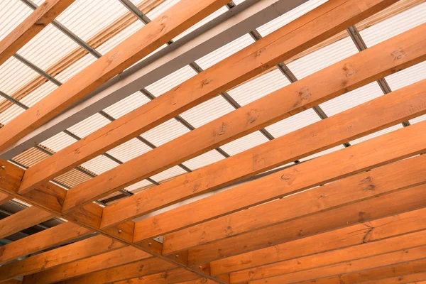 Wooden beams with fiber roof — Stock Photo, Image
