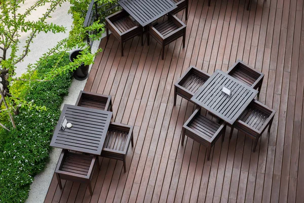 Top view of table and four chairs on living terrace at cafe. — Stock Image Top view of table and four chairs on living terrace at cafe. Royalty Free Stock Photos