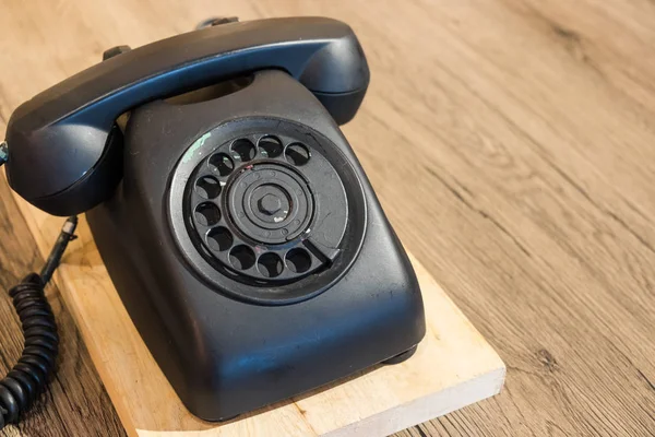 Vintage old telephone on wood table — Stock Photo, Image