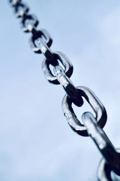 strong steel chain for industry, blue background