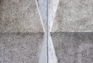 Yüksek çözünürlüklü çatlaklara sahip beton duvar dokularının detaylı yakın görüntüsü