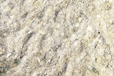 Yüksek çözünürlüklü kumlu zemin ve kirli dokular üzerine ayrıntılı yakın görüntü