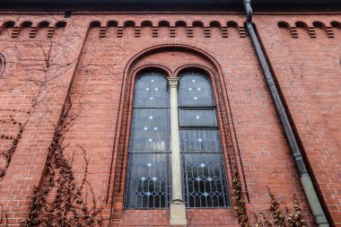 Old weathered and aged religious church building walls and windows
