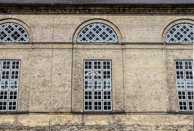 Old weathered and aged religious church building walls and windows