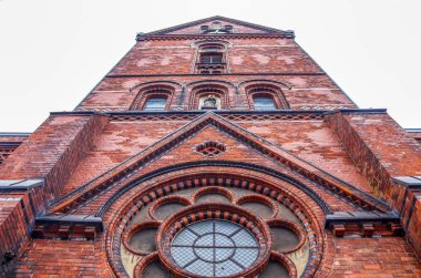 Old weathered and aged religious church building walls and windows