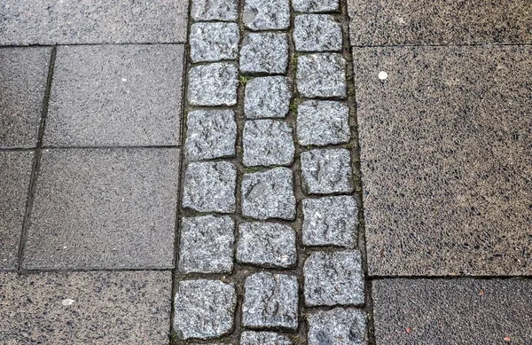 Detaillierte Nahaufnahme Auf Alten Kopfsteinpflasterstraßen Und Gehwegen — Stockfoto